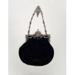Edwardian silver hinged mounted black velvet evening bag, the hinge cast with swags of laurel and