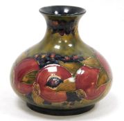 Moorcroft Pomegranate pattern globular vase, impressed marks and green signature to base, with