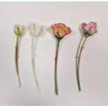 Four English porcelain models of roses, probably Royal Worcester, naturalistically modelled, with