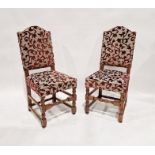 Set of four reproduction oak dining chairs, each with broken arched padded back and seat, in