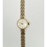 9ct gold Smiths lady's manual wind wristwatch, the circular silvered dial with gilt baton hour