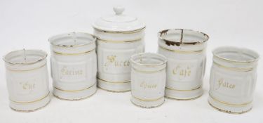 French enamelled tin set of storage jars, cylindrical, the tallest 20cm high.