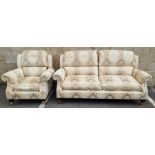 Modern sofa suite by Parker Knoll, comprising a two-seater sofa and an armchair, each upholstered in