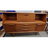Mid 20th Century highboard / sideboard by Jentique, with central cocktail compartment flanked by