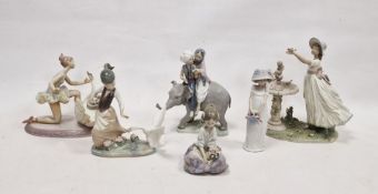 Six Lladro figures, printed and impressed marks, including: an Eastern couple riding an elephant,