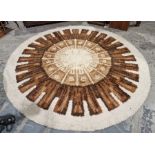 Large modern circular cream ground rug with central cog design 242cm