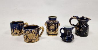Group of early 19th century Mason's Patent ironstone blue-ground mugs, jugs and a teacaddy,