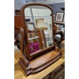 Victorian mahogany swing toilet mirror with arched plate, on scroll supports, shaped plinth base,