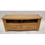 A modern oak TV stand, measuring approx. 52cm high x 130cm wide x 48cm deep.