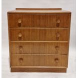 Mid-century blonde oak chest of drawers by Meredew having four long drawers with turned wooden