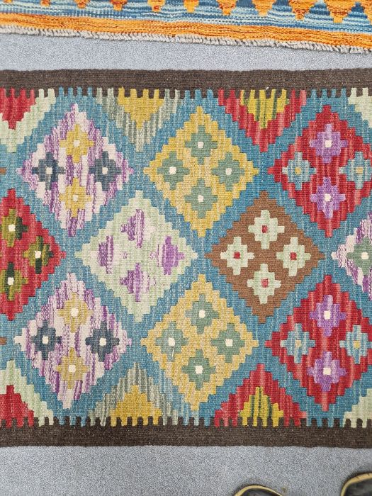 Blue ground Maimana kilim runner with one central row of nine lozenge floral medallions flanked by - Image 4 of 8