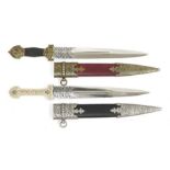 Matched pair of Persian-style daggers, each with chased blade and having scabbard with embossed