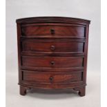Past Times mahogany bowfronted jewellery chest of four drawers, on bracket feet
