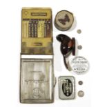 Old metal cased 'Addiator' calculator, a toothpaste pot lid and a small quantity of sundry