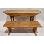 Modern pine drop-leaf dining table of oval form, 77cm high x 166cm wide x 62cm deep when folded
