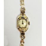Lady's rolled gold and enamel Iris cocktail watch, the bezel with floral enamel decoration, button