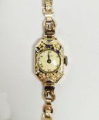 Lady's rolled gold and enamel Iris cocktail watch, the bezel with floral enamel decoration, button