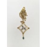 Edwardian 15ct gold, pale blue stone and seedpearl pendant of open lozenge form, centred by three-