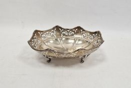 George V silver footed oval bowl, with shaped rim pierced with interlocking scrolls and ovolos,