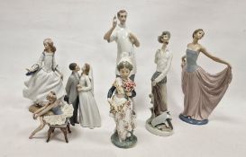 Seven Lladro figures, printed and impressed marks, including: a dentist, a group of bride and groom,