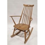 Mid-century Ercol elm and beech rocking chair, with spindle back and labelled to seat base, 87cm