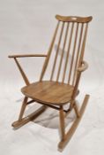 Mid-century Ercol elm and beech rocking chair, with spindle back and labelled to seat base, 87cm