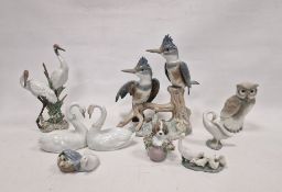 Group of eight Lladro and Nao figures, printed and impressed marks, including: a pair of swans in