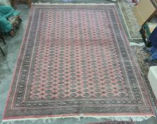 Persian rug, red ground, multi gold in cream and green rectangular lozenge, with multi-border;