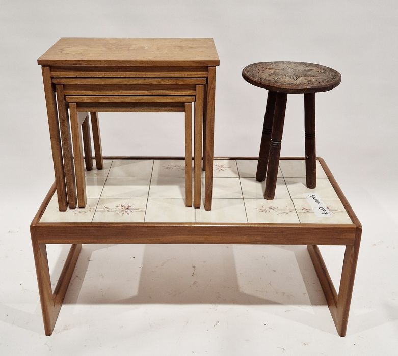 Nest of three oak occasional tables of rectangular form, raised on square legs, largest measuring
