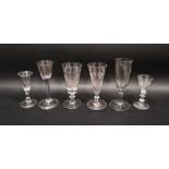 Six 18th century drinking glasses, including: three engraved ale glasses, a wine-glass engraved with