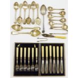 Assortment of silver plated flatware including spoons, sugar tongs and knives, some in original