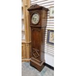Early 20th century oak cased grandmother clock, the round convex glass door revealing silvered