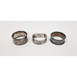 Three various silver napkin rings (3)