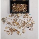Large quantity of gilt and gold-coloured metal costume jewellery in black and white jewellery