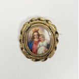 Antique painted porcelain and plaited hair brooch, the porcelain plaque depicting child crowned Mary