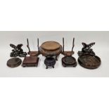 Group of Asian and European carved wood display stands, including a pair formed from flowering