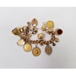 9ct gold curb-link charm bracelet with 1793 half-guinea, 1913 sovereign, George III third guinea,
