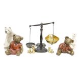 Pair of cast iron and brass balance scales, a quantity of polished hard stones, bronze effect