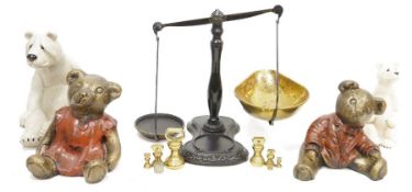 Pair of cast iron and brass balance scales, a quantity of polished hard stones, bronze effect