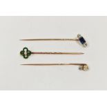 Antique gold-coloured metal, sapphire and diamond stickpin set rectangular sapphire flanked by two