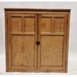 Early 20th century pine kitchen cupboard with double panelled doors enclosing four shelves, 111cm