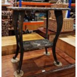 Carved oak occasional table, rectangular, allover sunflower decorated with undershelf, on scroll