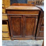 Victorian mahogany cabinet having one drawer raised above a two door cupboard, the cupboard