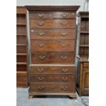 Georgian oak chest on chest secretaire, the top section having two short over four long drawers, the