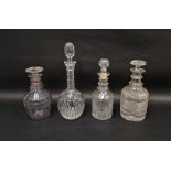 Four early-mid 19th century cut-glass decanters and stoppers, variously cut with stars, diamonds and