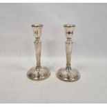 Pair of tapering silver candlesticks, on reeded domed feet, hallmarked Birmingham 2003, maker's