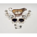 Silver six-piece condiment set, baluster-shaped and each piece raised on four tab feet and a