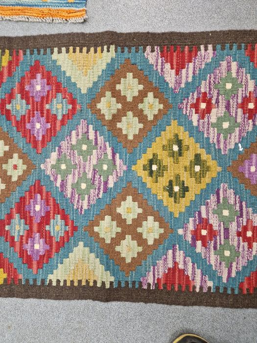 Blue ground Maimana kilim runner with one central row of nine lozenge floral medallions flanked by - Image 3 of 8