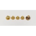 Three 18ct gold studs with engraved circular terminals and another 18ct gold stud with ball