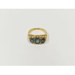 18ct gold, blue stone and diamond dress ring set three pale blue oval cut stones interspersed by